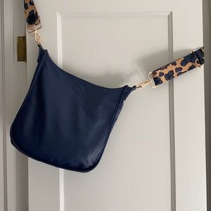 Ah-dorned Cross body or shoulder bag.